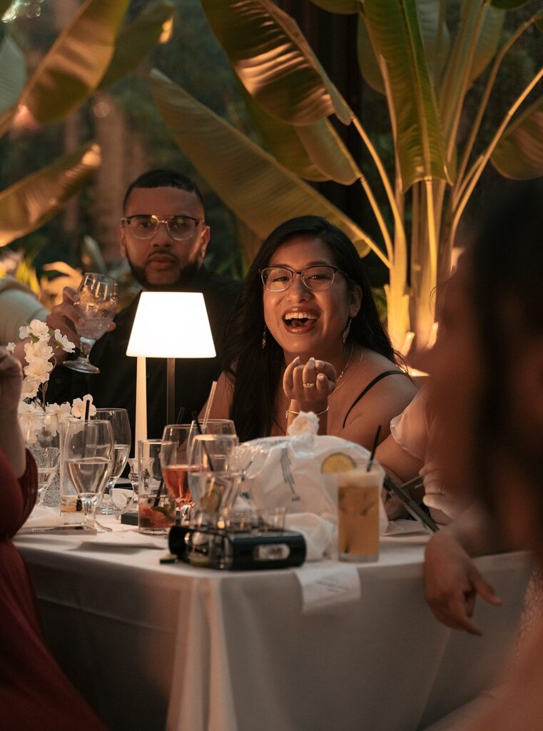 Guests laugh at a Westchester NY wedding reception 