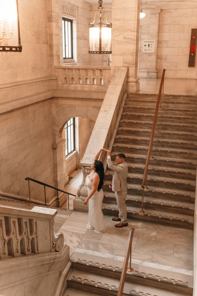 Newlyweds share a dance in the stairwell following their NYC City Hall elopement. 